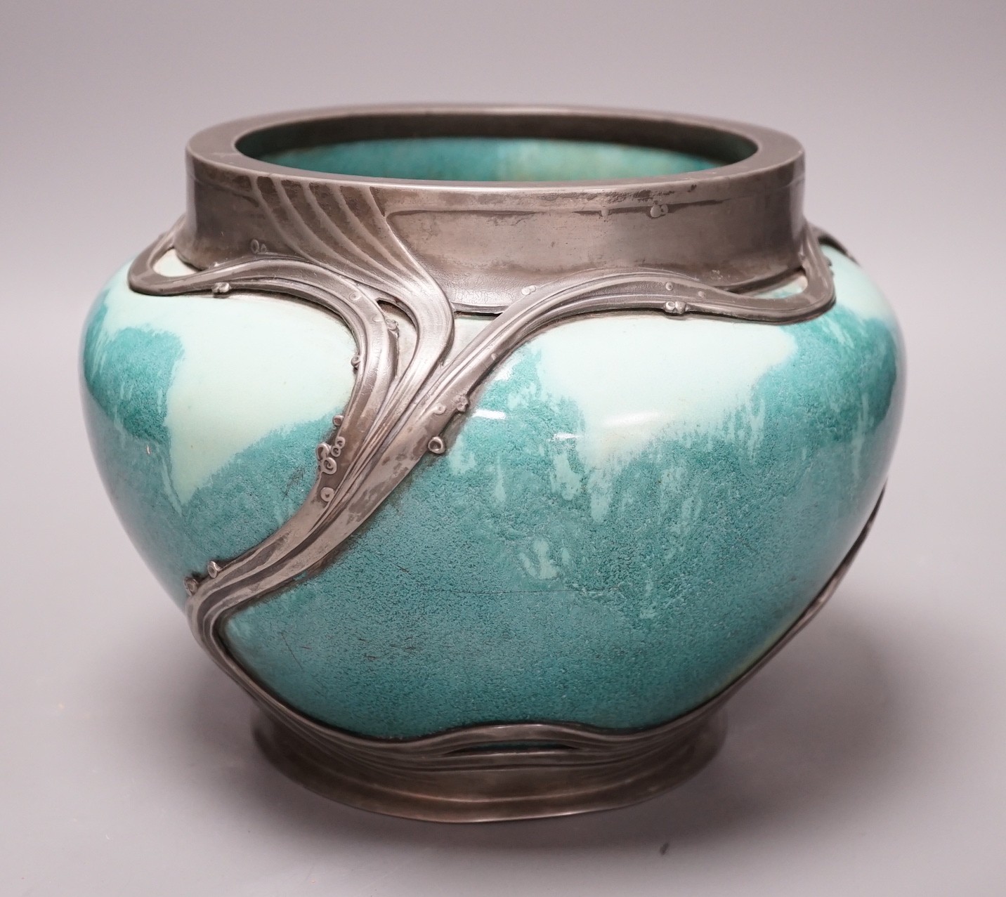 An Art Nouveau Orvit pewter mounted Ruskin style turquoise glazed jardiniere, 18cms high